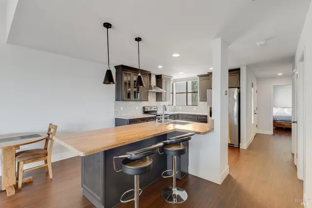 a living room with a fireplace and a flat screen tv