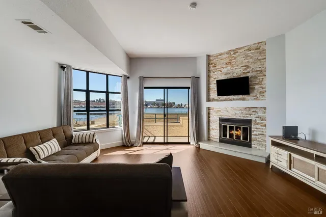 a view of a living room with a floor to ceiling window