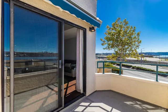 a view of workspace with furniture and a window