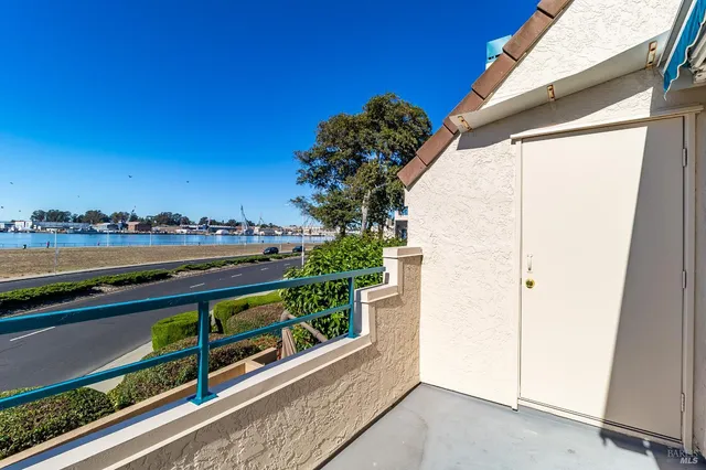 a view of an empty room and wooden floor