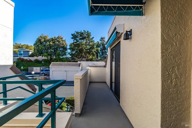 a view of balcony and kitchen