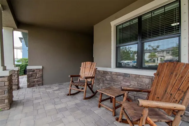 an aerial view of residential house with outdoor space and lake view