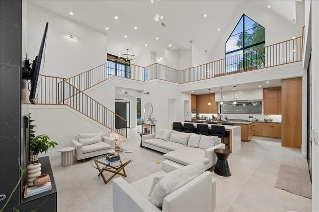 a living room with furniture and large window