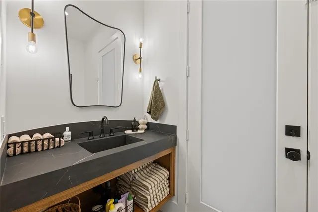 a living room with furniture and kitchen view