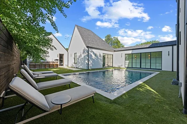 a view of swimming pool with a yard