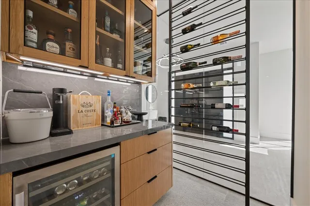 a kitchen with a refrigerator and cabinets