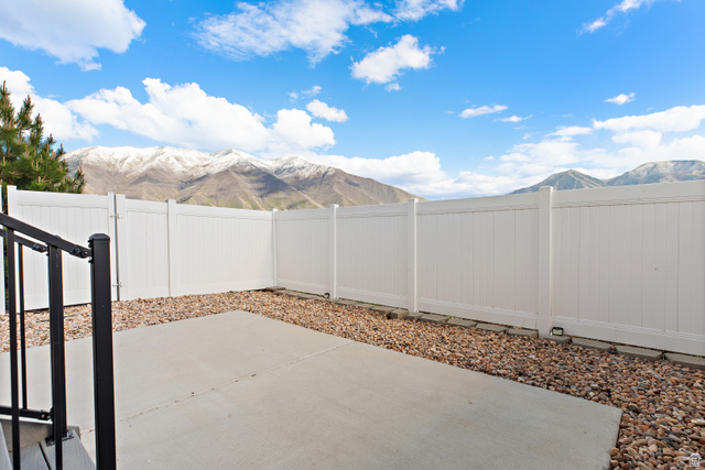 2343 Wysteria Drive Mapleton, UT 84664 - Photo 29 of 30 Fenced backyard featuring a mountain view and a patio