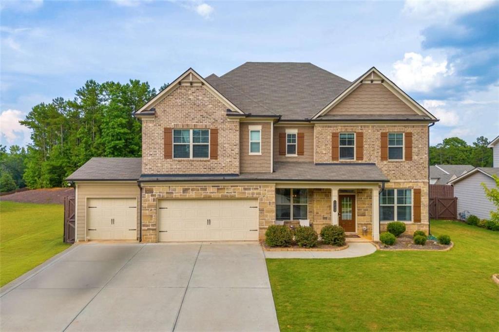 front view of a house with a yard