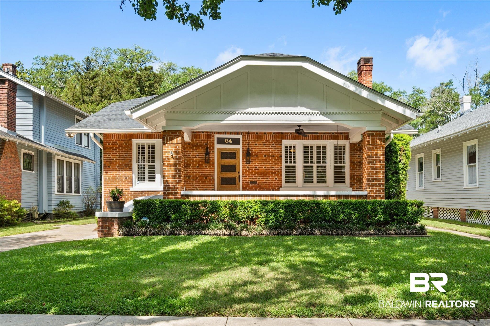24 Macy Place Mobile, AL 36604 - Photo 1 of 38 View of front of house with brick siding, a ceiling fan, and a front lawn
