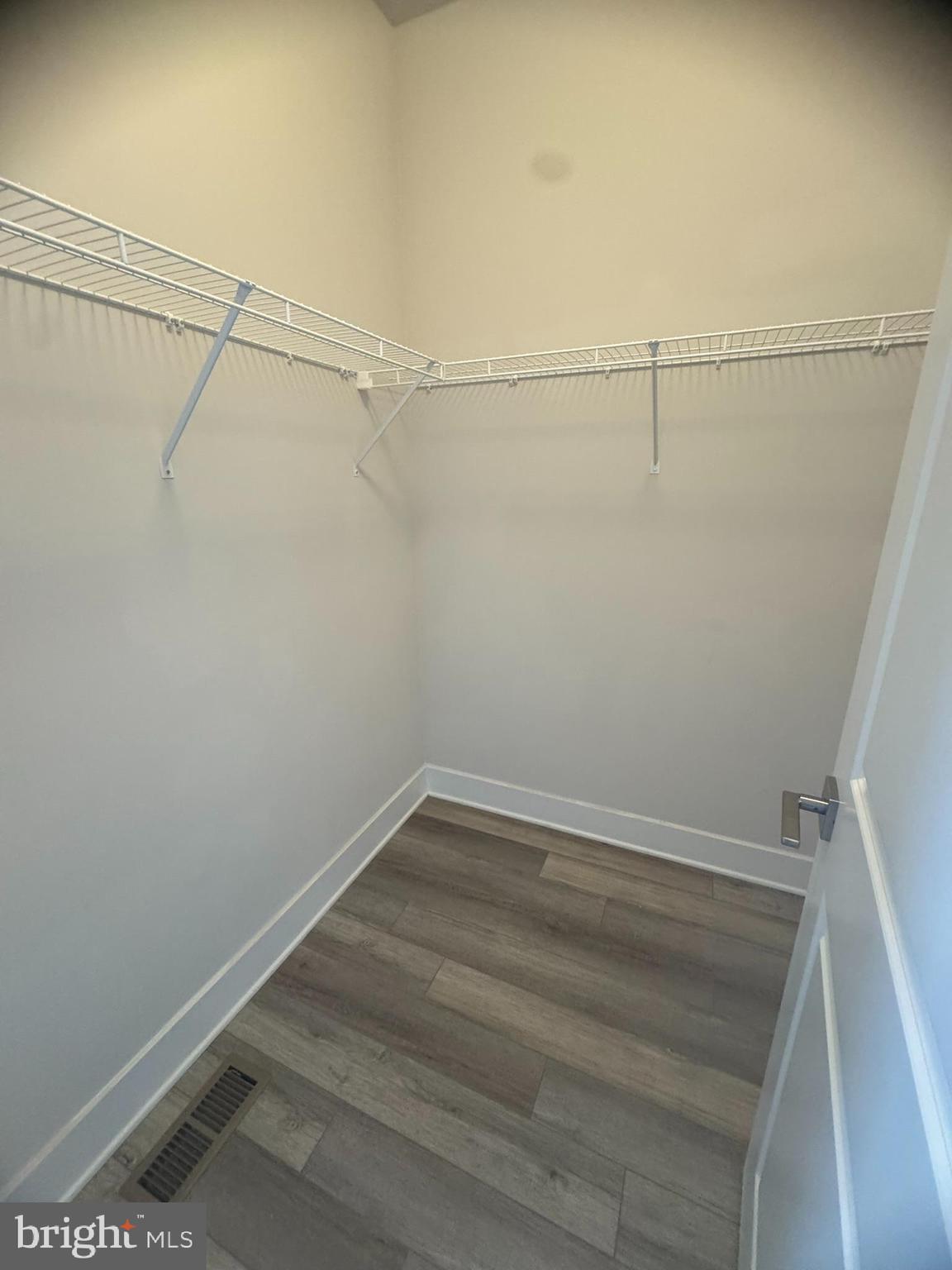 7919 Wormans Mill Road Frederick, MD 21701 - Photo 15 of 23 a view of a room with racks on the wall