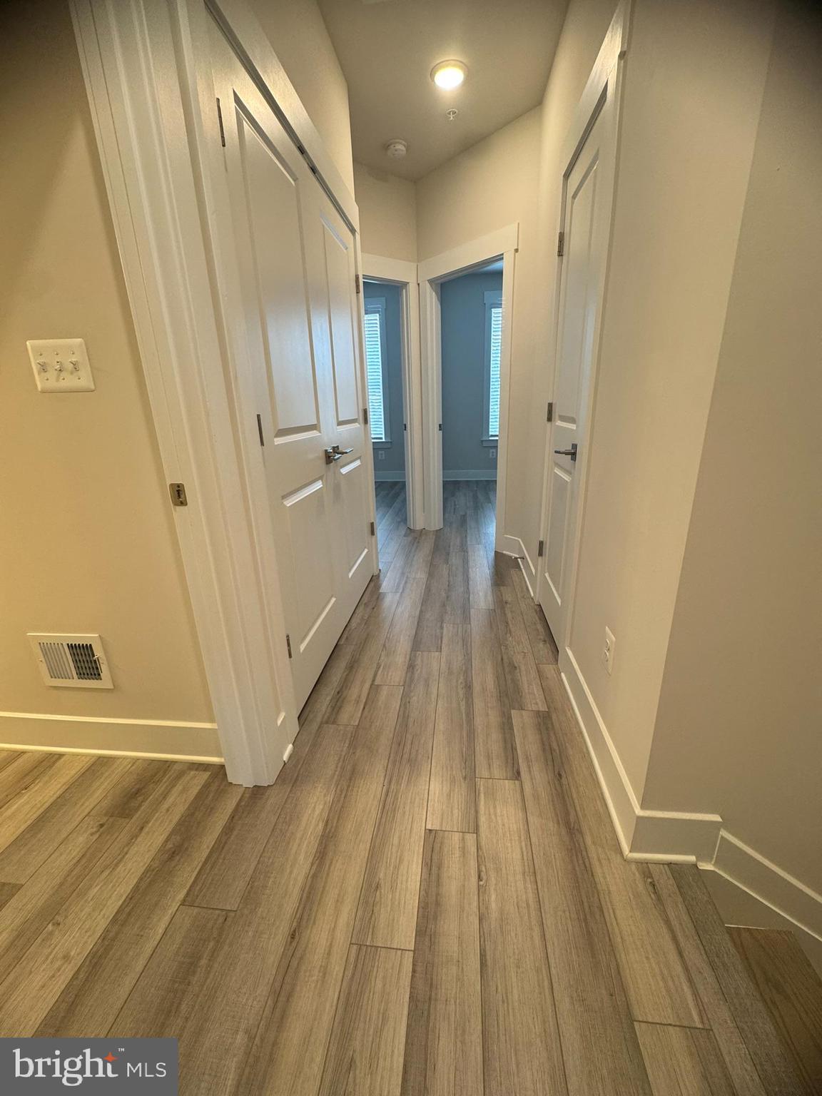 7919 Wormans Mill Road Frederick, MD 21701 - Photo 16 of 23 a view of a hallway with wooden floor