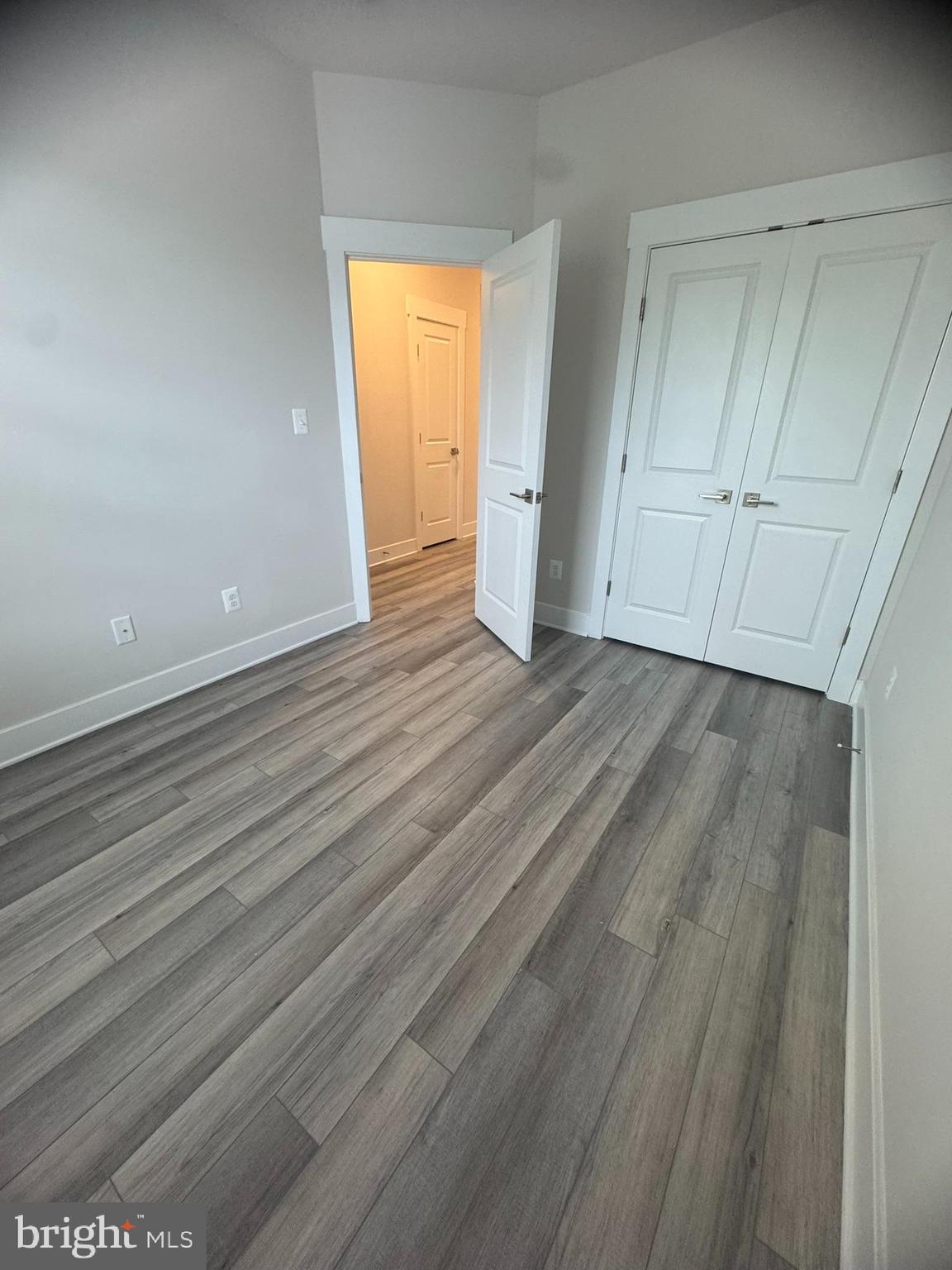 7919 Wormans Mill Road Frederick, MD 21701 - Photo 19 of 23 a view of an empty room with closet and a window