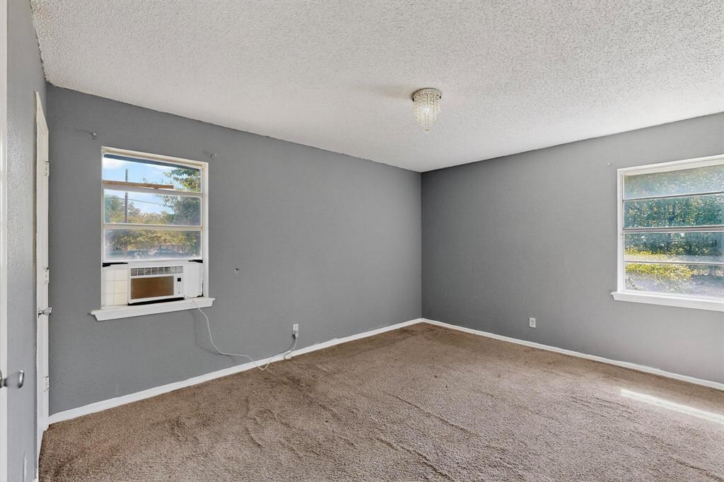 702 Rea Avenue Lancaster, TX 75146 - Photo 19 of 37 a view of an empty room with a window