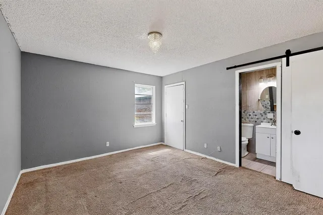 a view of a big room with windows and closet