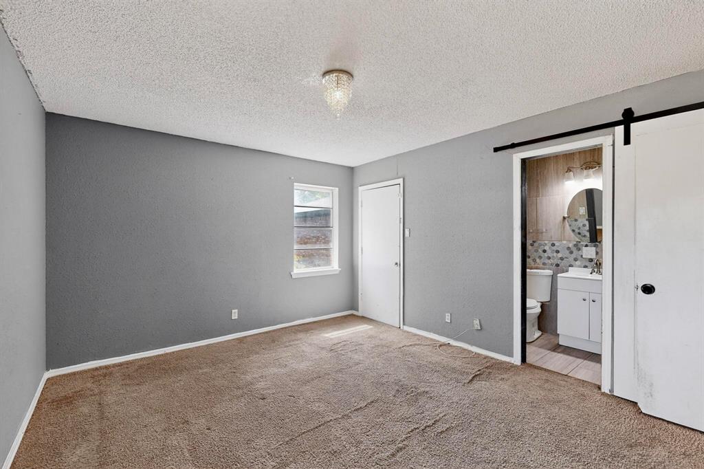 702 Rea Avenue Lancaster, TX 75146 - Photo 20 of 37 a view of a big room with windows and closet