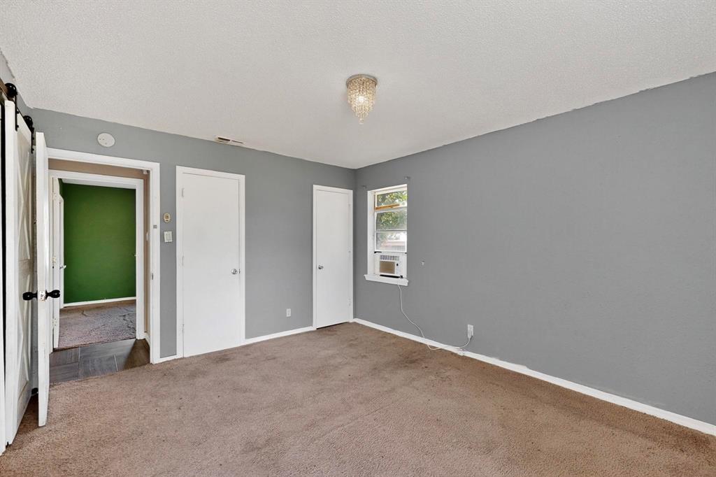 702 Rea Avenue Lancaster, TX 75146 - Photo 22 of 37 a view of an empty room with window and closet area