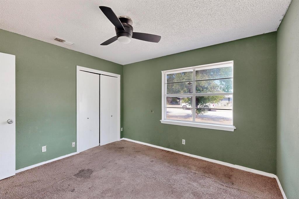 702 Rea Avenue Lancaster, TX 75146 - Photo 27 of 37 a view of a livingroom with a ceiling fan and window