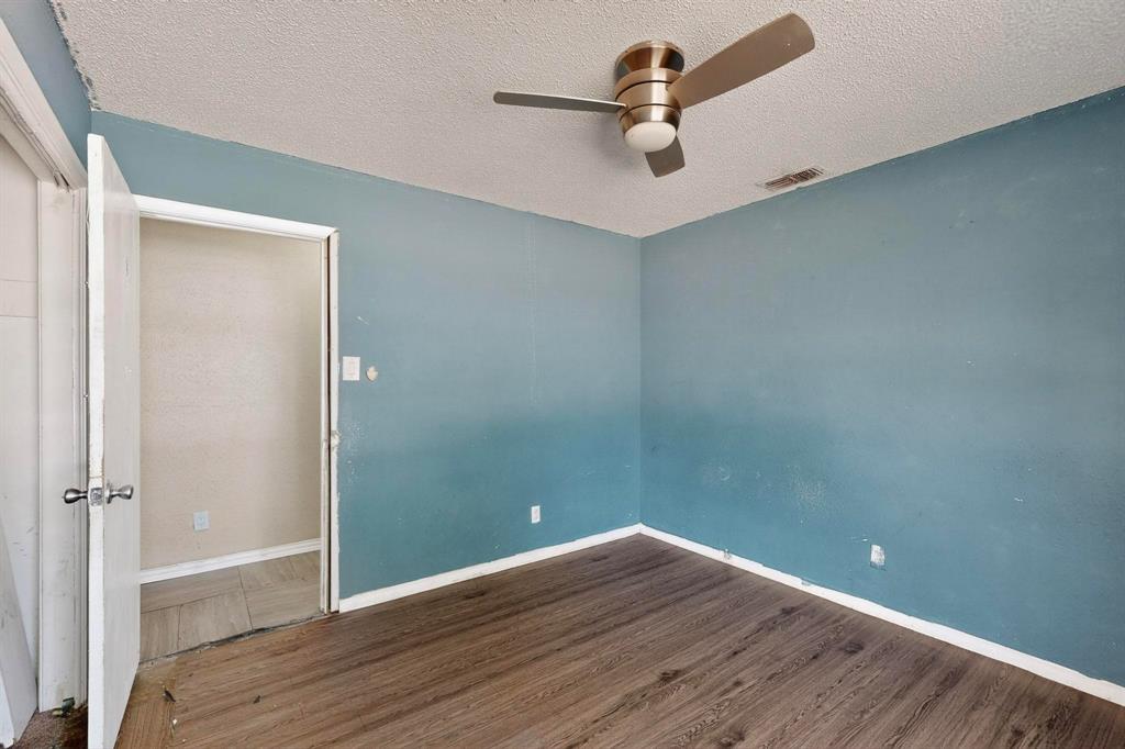 702 Rea Avenue Lancaster, TX 75146 - Photo 32 of 37 wooden floor in an empty room