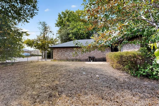 a backyard of a house with lots of green space