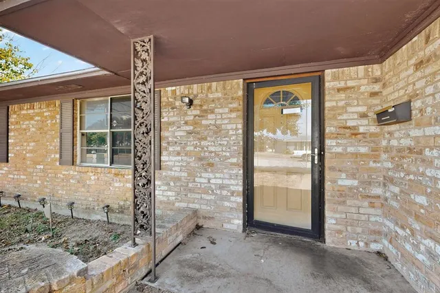 a front view of a house with a glass door