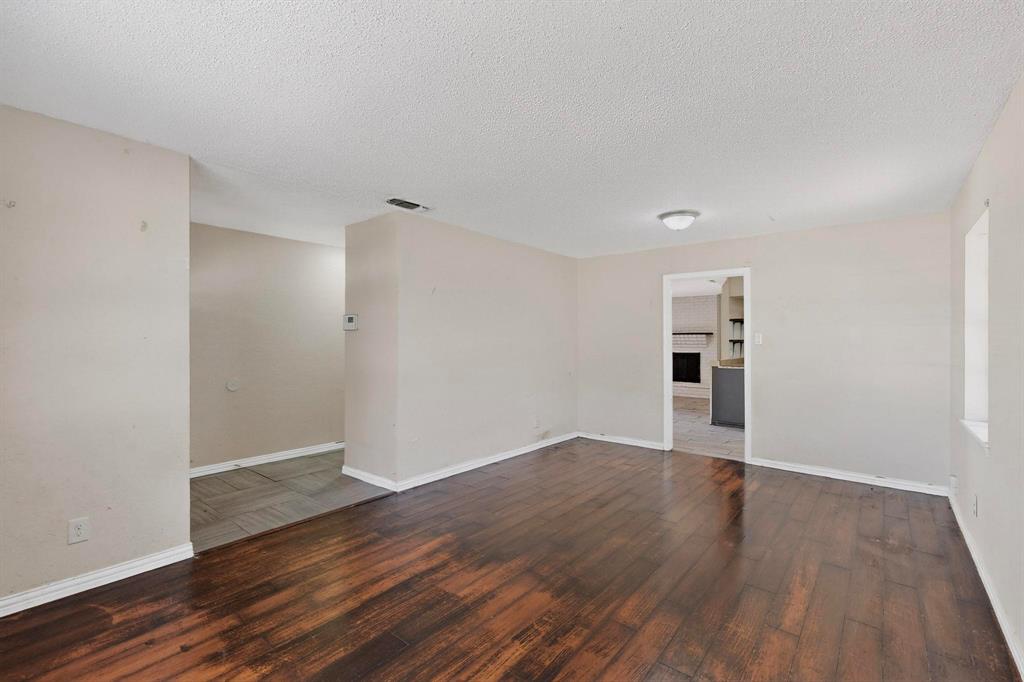 702 Rea Avenue Lancaster, TX 75146 - Photo 7 of 37 a view of empty room with wooden floor