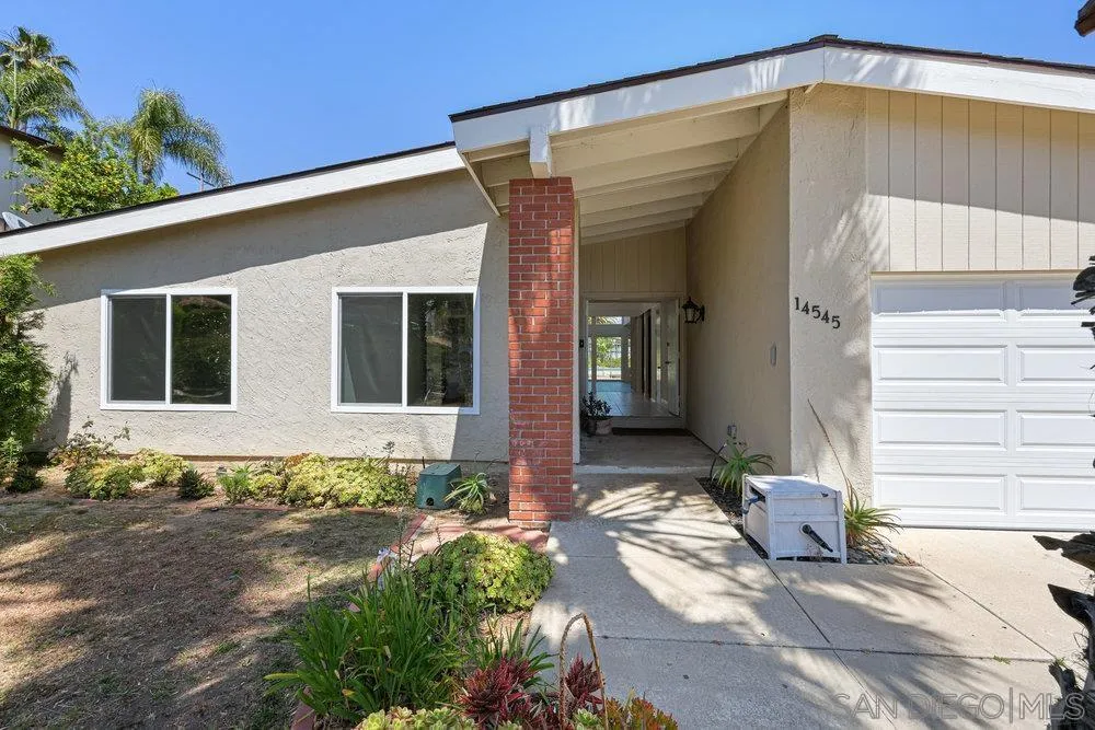 14545 Hillndale Way Poway, CA 92064 - Photo 1 of 27 a front view of a house with a yard