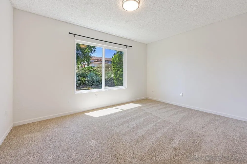 14545 Hillndale Way Poway, CA 92064 - Photo 23 of 27 an empty room with windows