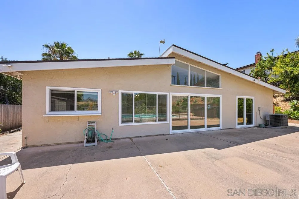 14545 Hillndale Way Poway, CA 92064 - Photo 25 of 27 a front view of a house with a yard and potted plants