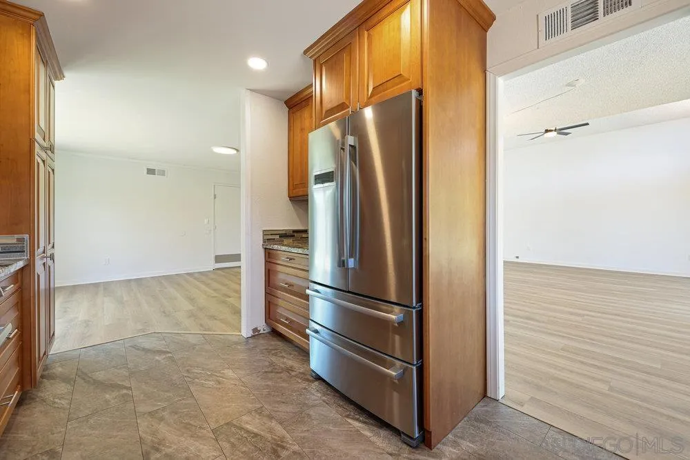 14545 Hillndale Way Poway, CA 92064 - Photo 5 of 27 a view of kitchen with stainless steel appliances wooden floor and cabinets