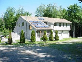 200 Dimmock Road Otis, MA 01253 - Photo 1 of 2 a front view of a house with a garden