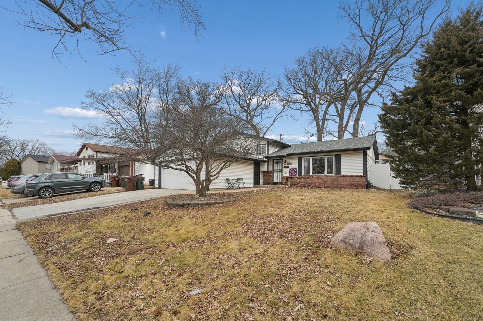 5166 Aldersyde Road Oak Forest, IL 60452 - Photo 2 of 12 a front view of a house with a yard and trees