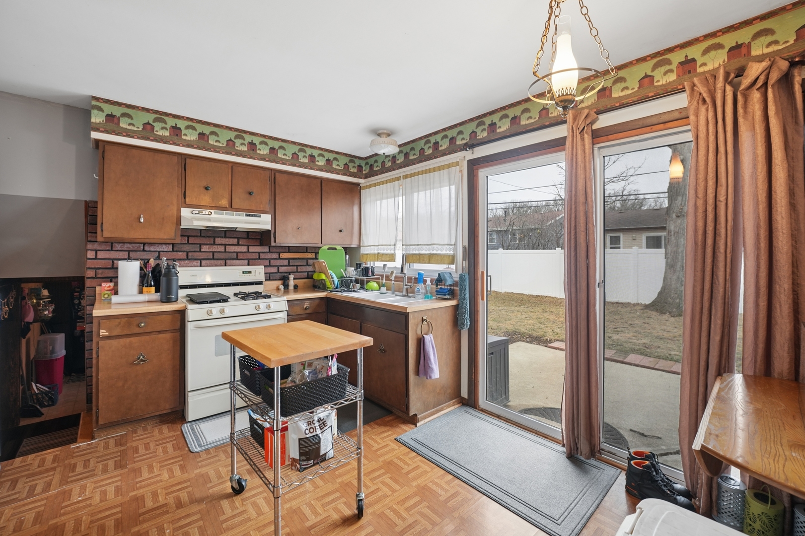 5166 Aldersyde Road Oak Forest, IL 60452 - Photo 5 of 12 a kitchen with stainless steel appliances granite countertop a refrigerator and a stove top oven