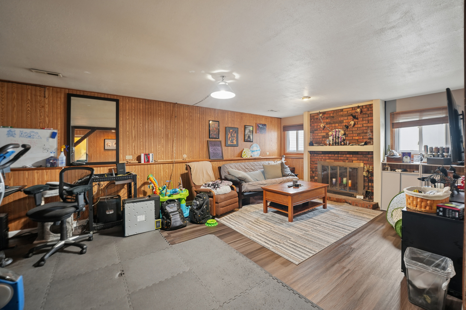 5166 Aldersyde Road Oak Forest, IL 60452 - Photo 7 of 12 a living room with furniture a rug and a large window