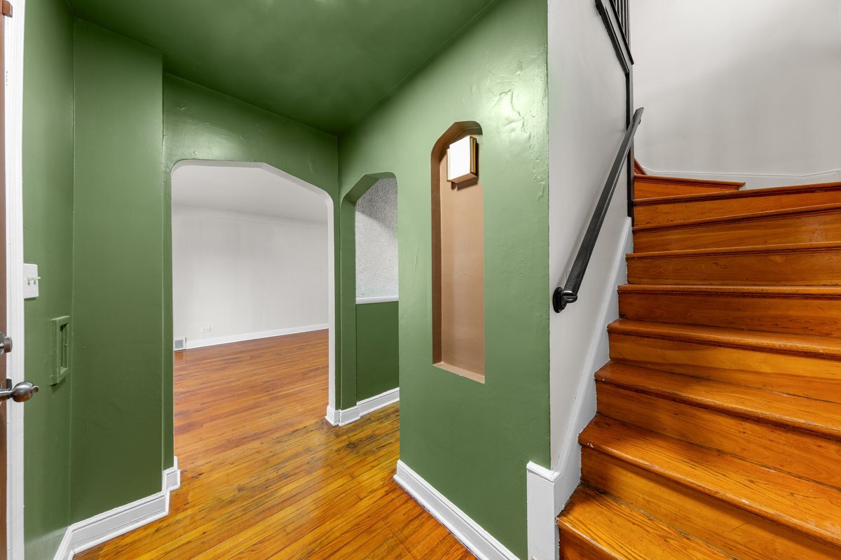 8142 South Yates Boulevard Chicago, IL 60617 - Photo 11 of 25 a view of entryway and hall with wooden floor