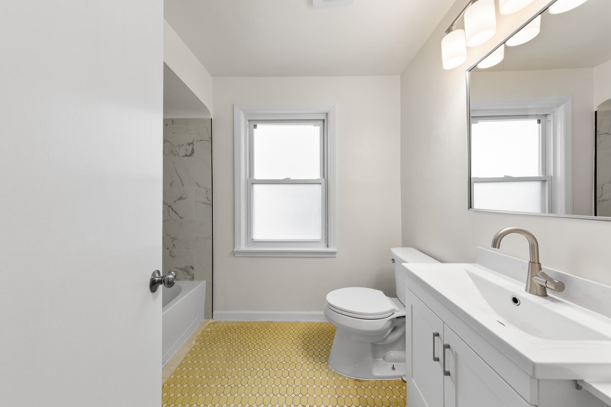 8142 South Yates Boulevard Chicago, IL 60617 - Photo 13 of 25 a bathroom with a sink toilet and shower