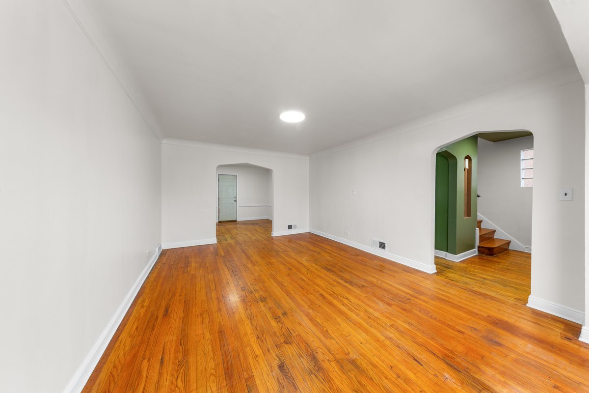 8142 South Yates Boulevard Chicago, IL 60617 - Photo 4 of 25 a view of empty room with wooden floor
