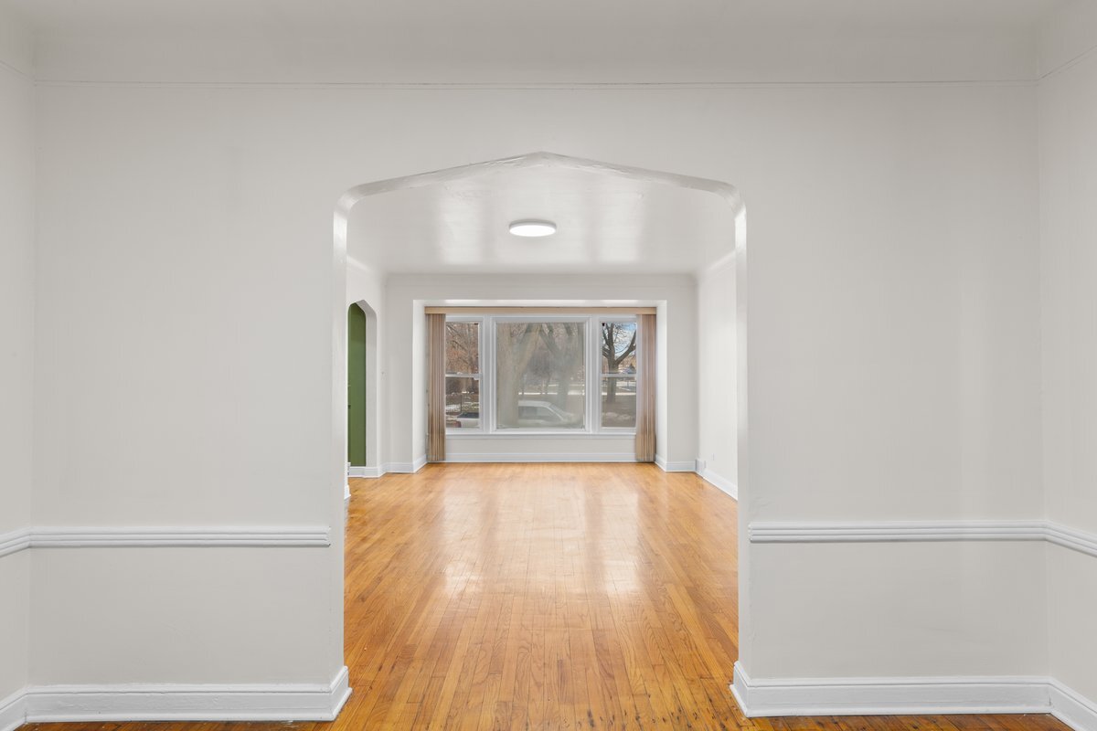 8142 South Yates Boulevard Chicago, IL 60617 - Photo 5 of 25 a bedroom with a bed and a window