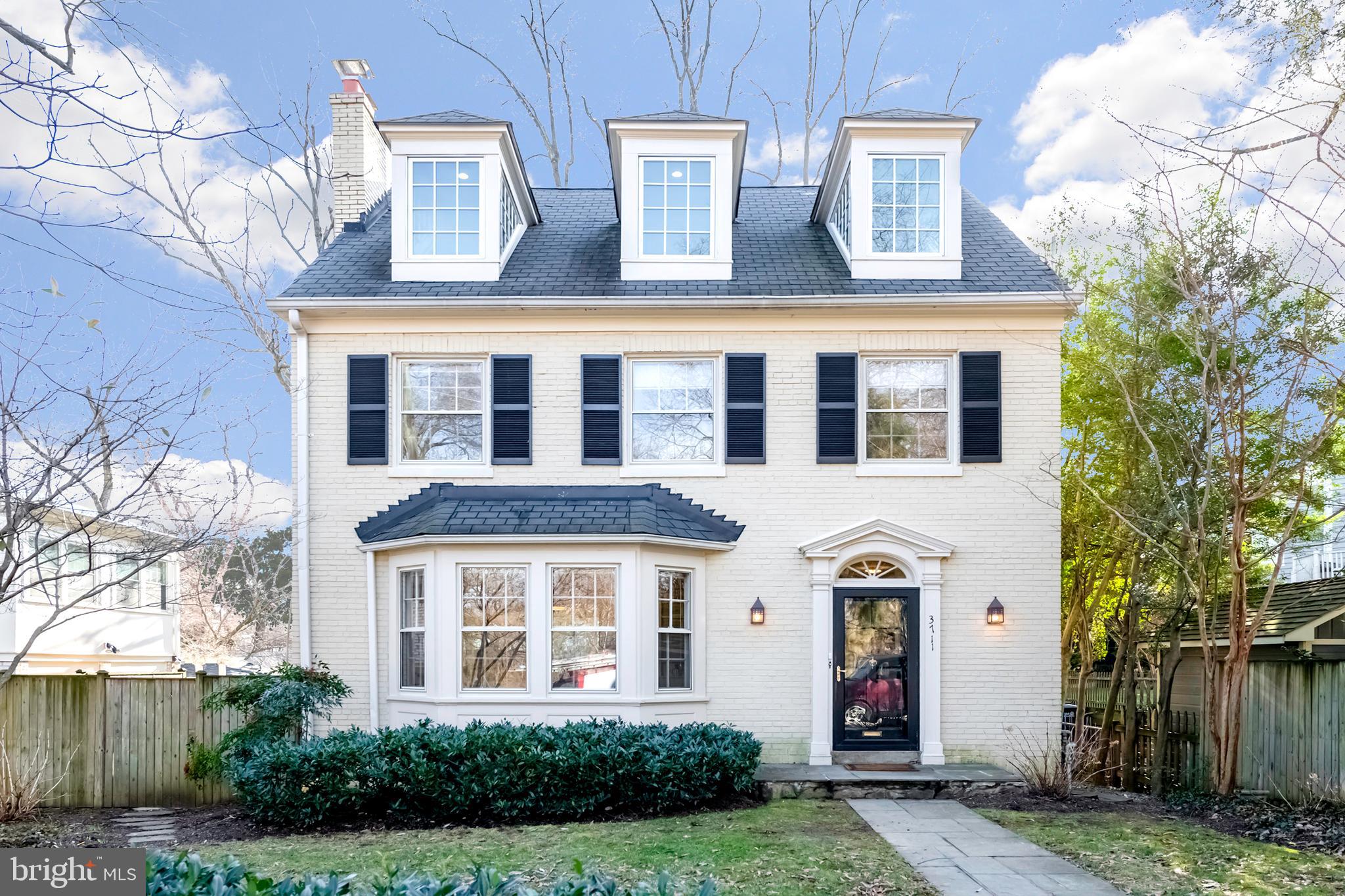 3711 Idaho Avenue Northwest Washington, DC 20016 - Photo 1 of 43 front view of a house with a yard