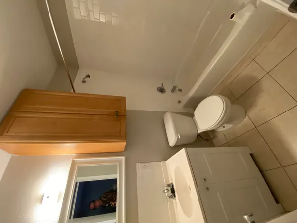 a kitchen with granite countertop cabinets and refrigerator