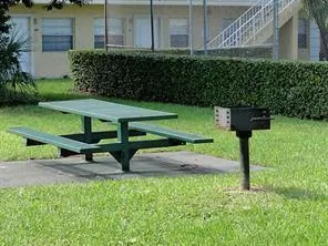 a view of a house with a wooden fence