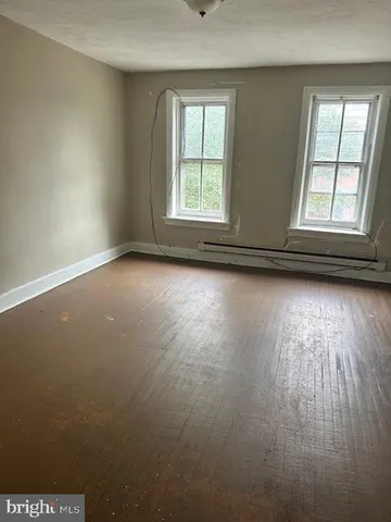 a kitchen with stainless steel appliances granite countertop a sink a stove a granite counter tops and a white cabinets