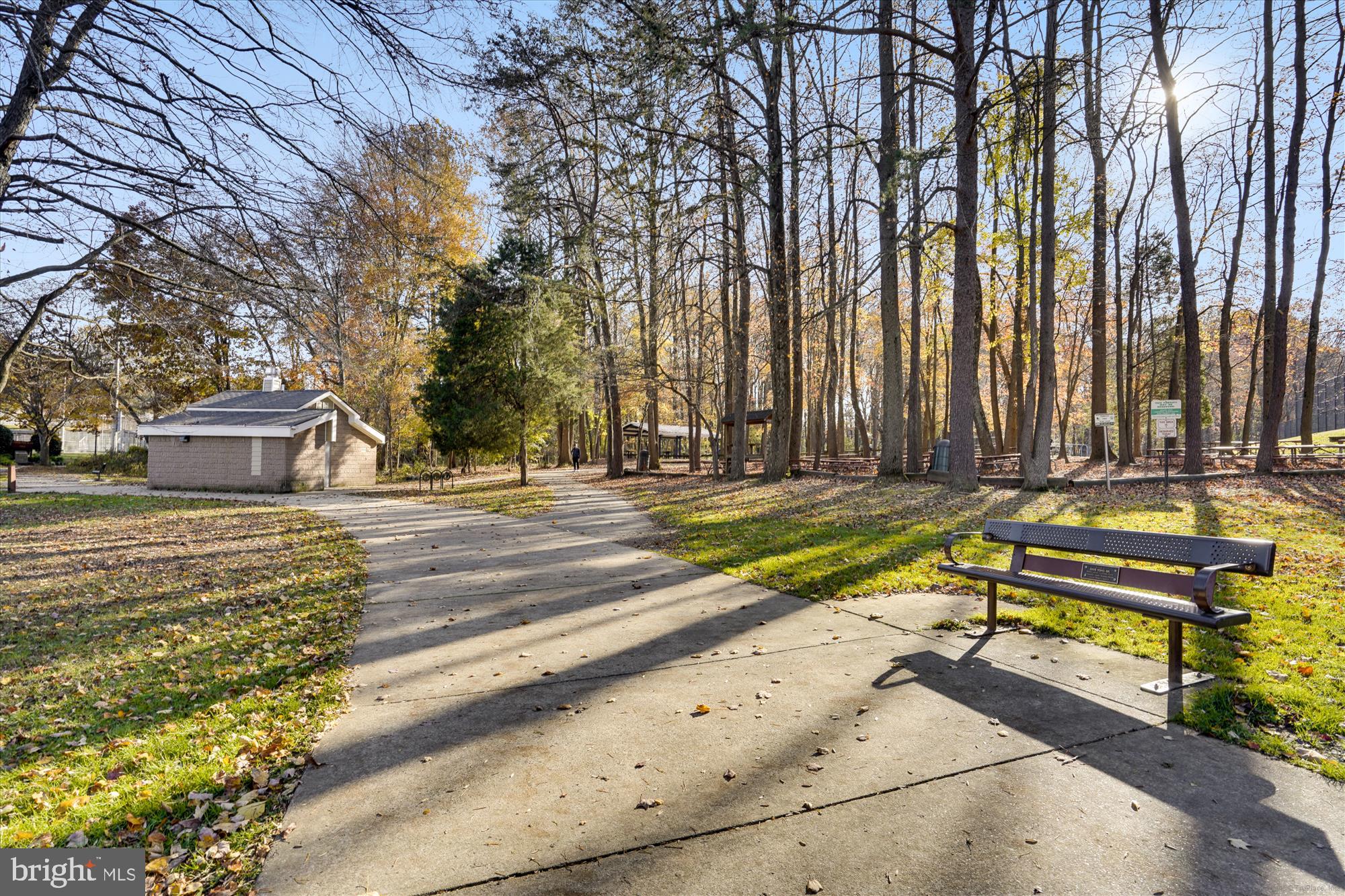 2627 Five Oaks Road Vienna, VA 22181 - Photo 106 of 111 a view of a swimming pool with a bench and trees