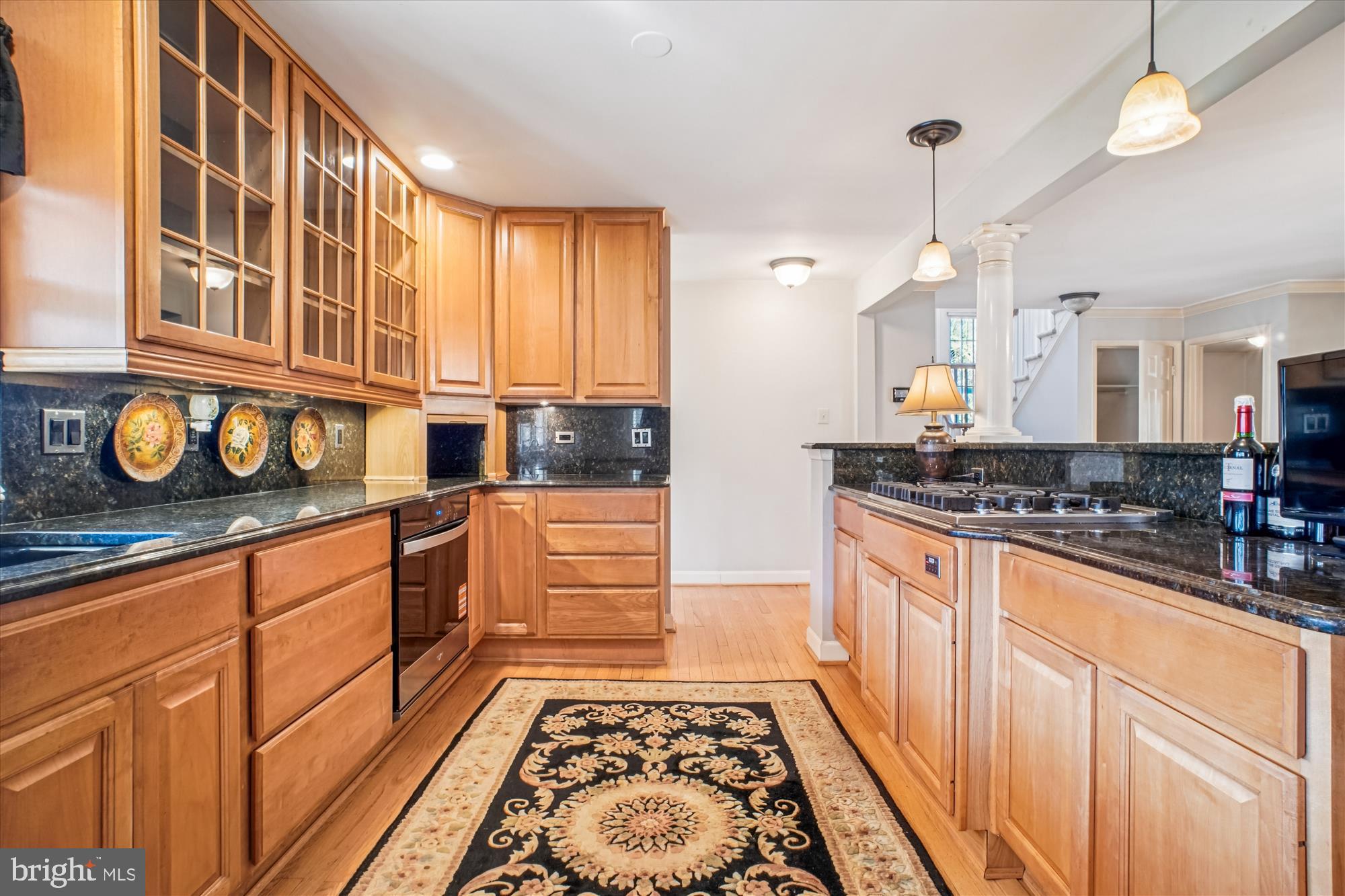 2627 Five Oaks Road Vienna, VA 22181 - Photo 20 of 111 a kitchen with stainless steel appliances granite countertop a stove a sink and a granite counter tops with wooden floors