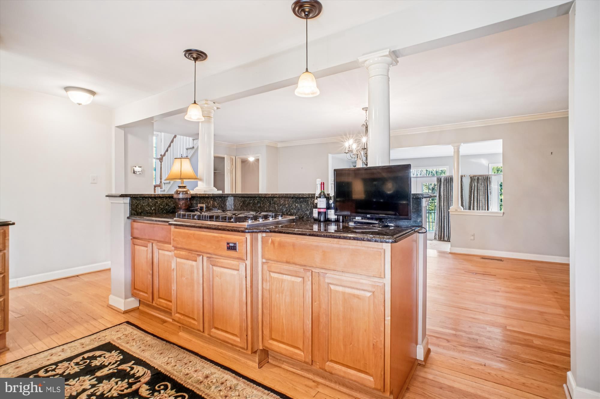 2627 Five Oaks Road Vienna, VA 22181 - Photo 25 of 111 a kitchen with stainless steel appliances granite countertop a stove a sink and a wooden floor