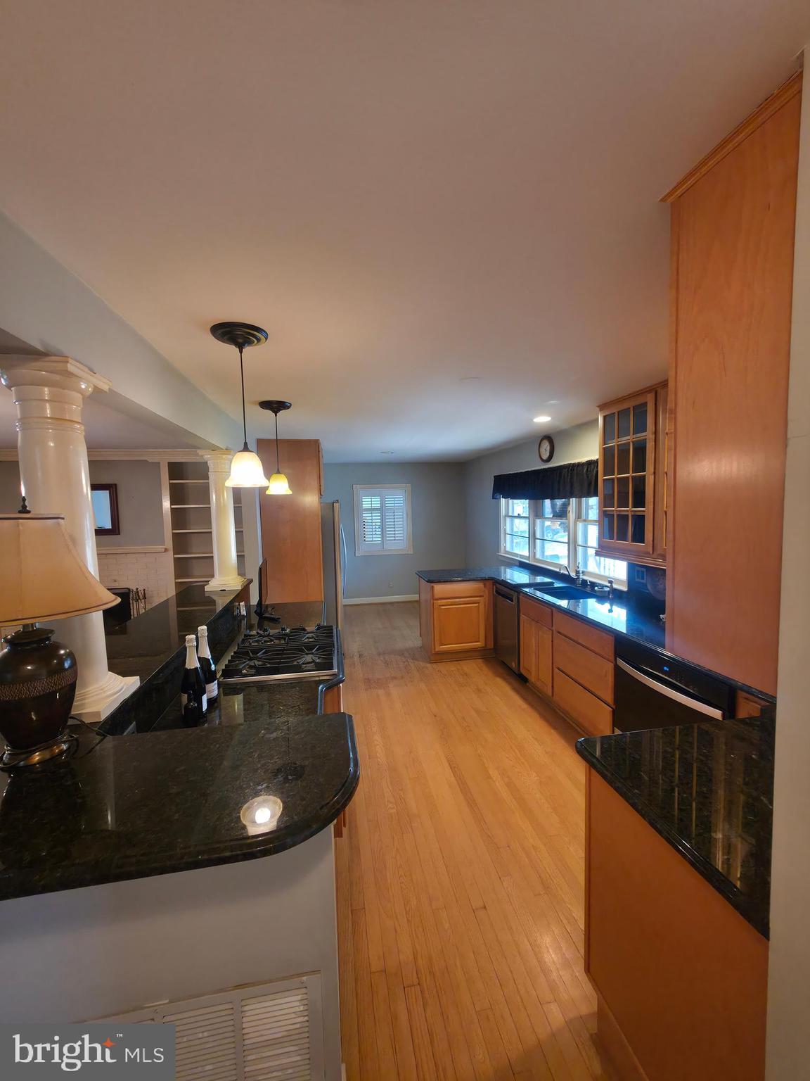 2627 Five Oaks Road Vienna, VA 22181 - Photo 26 of 111 a large kitchen with kitchen island a sink stainless steel appliances and cabinets