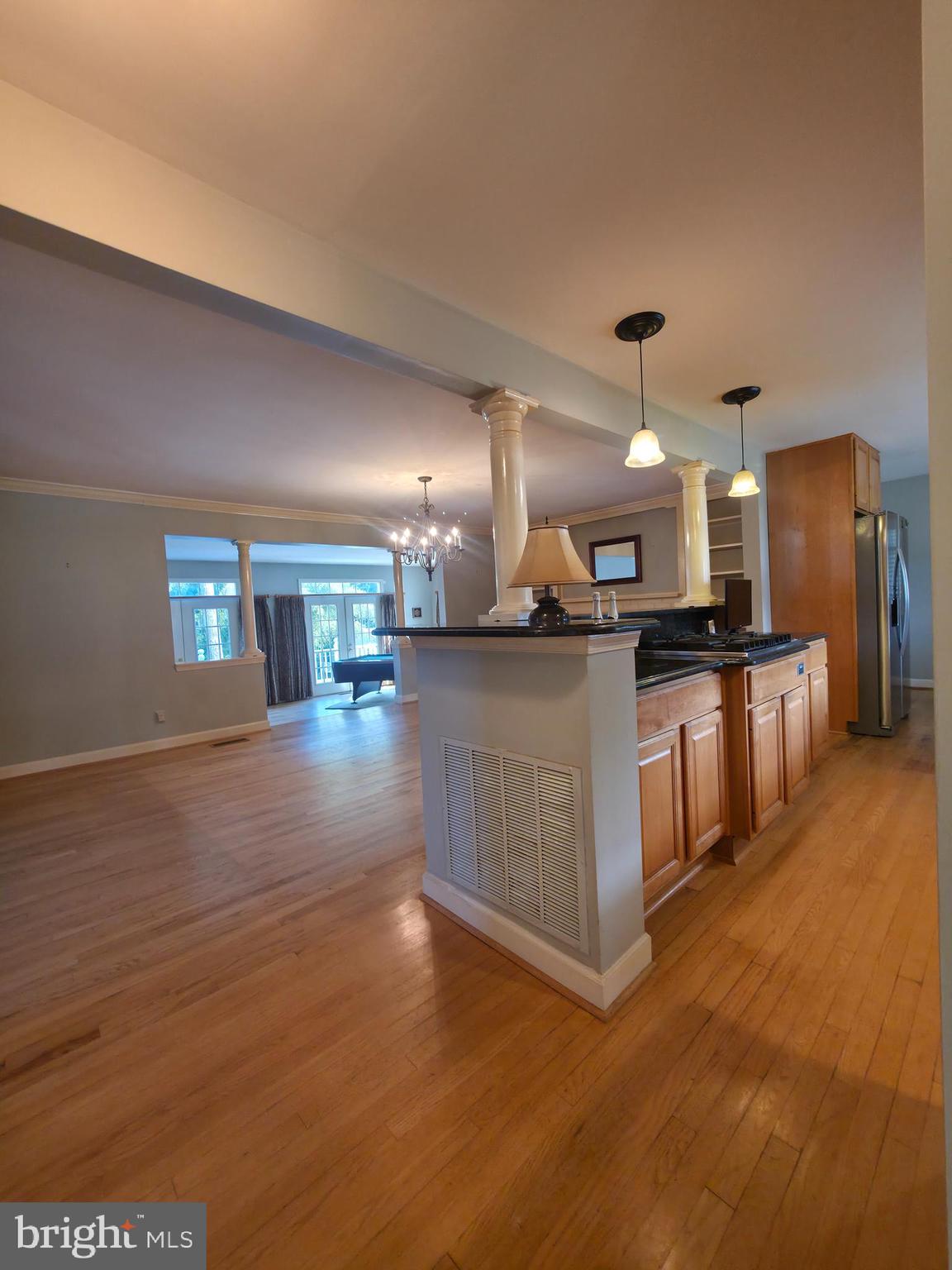2627 Five Oaks Road Vienna, VA 22181 - Photo 27 of 111 a kitchen with stainless steel appliances kitchen island granite countertop a stove and a sink