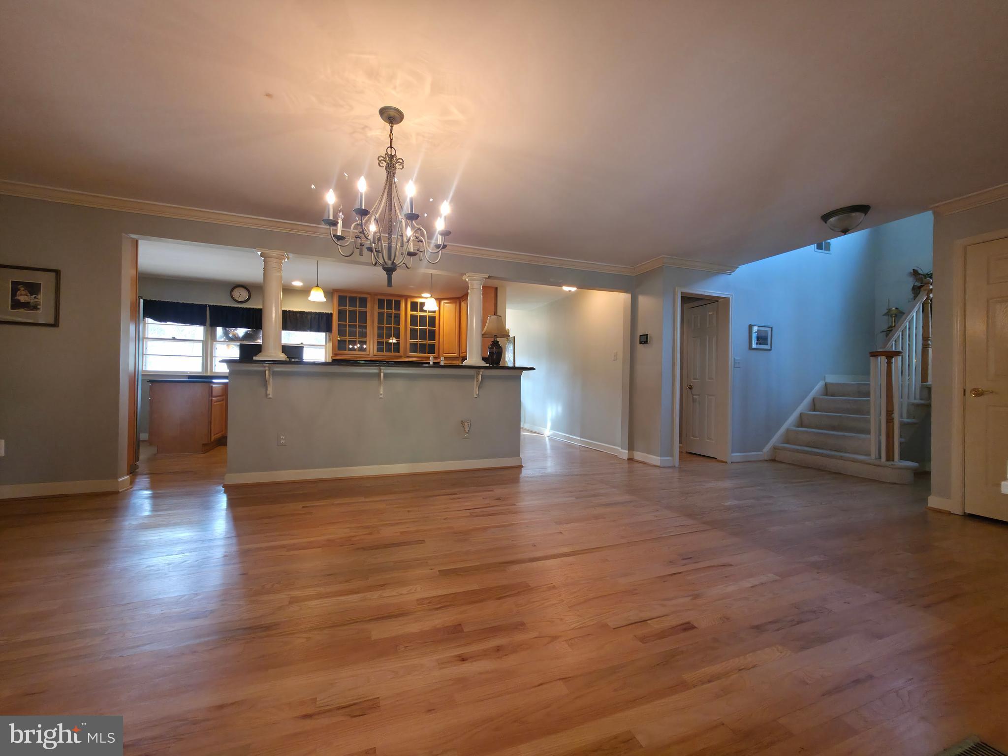 2627 Five Oaks Road Vienna, VA 22181 - Photo 33 of 111 a view of a kitchen with granite countertop a refrigerator and a wooden floor