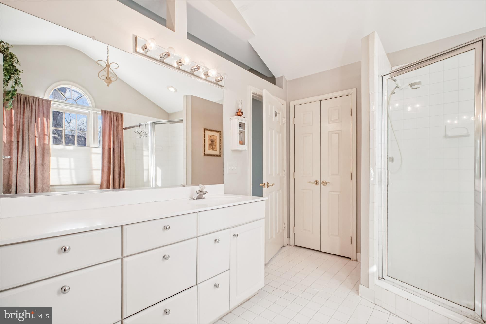 2627 Five Oaks Road Vienna, VA 22181 - Photo 49 of 111 a spacious bathroom with a double vanity sink mirror and shower