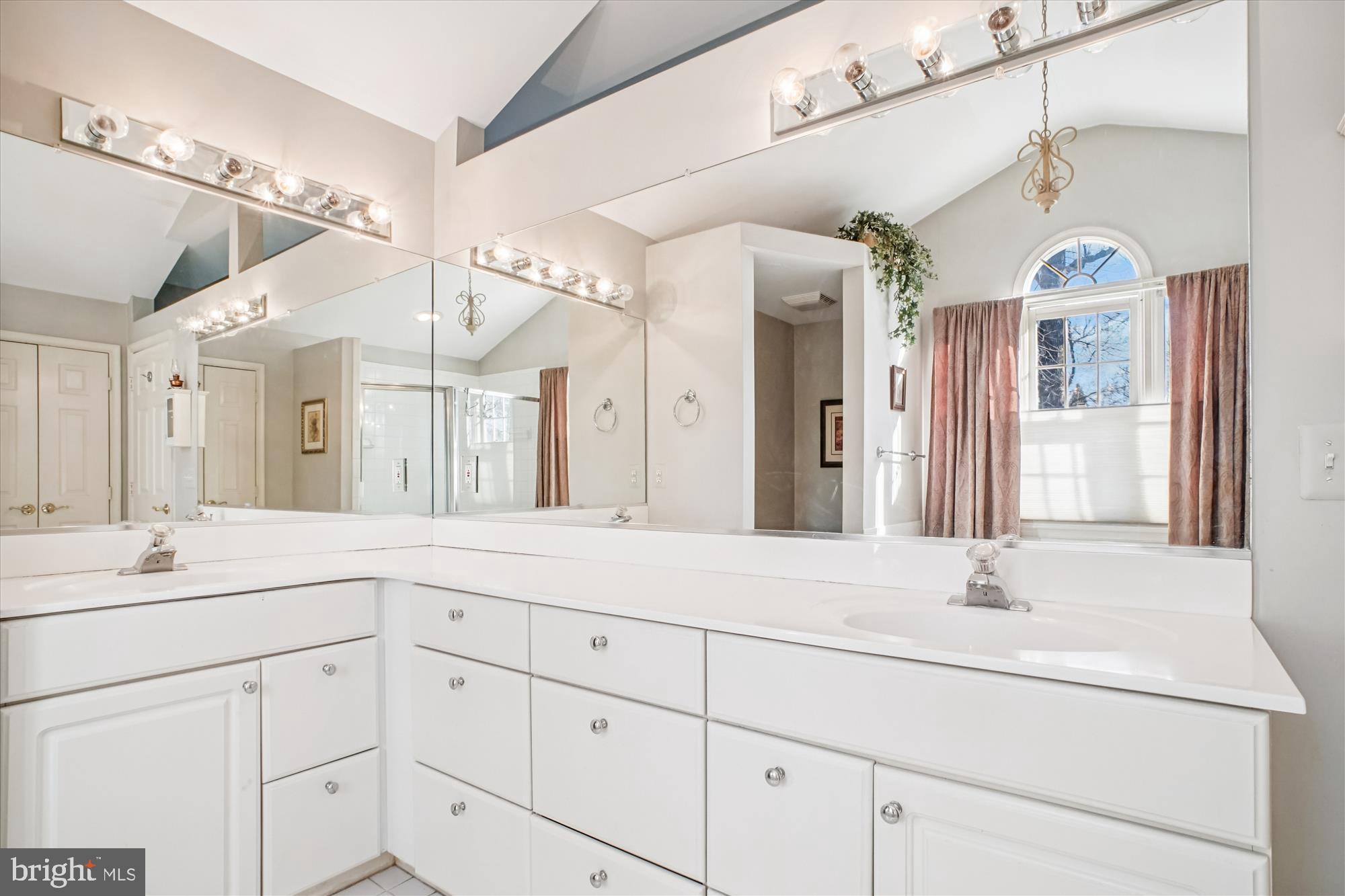 2627 Five Oaks Road Vienna, VA 22181 - Photo 50 of 111 a bathroom with a sink vanity and a mirror