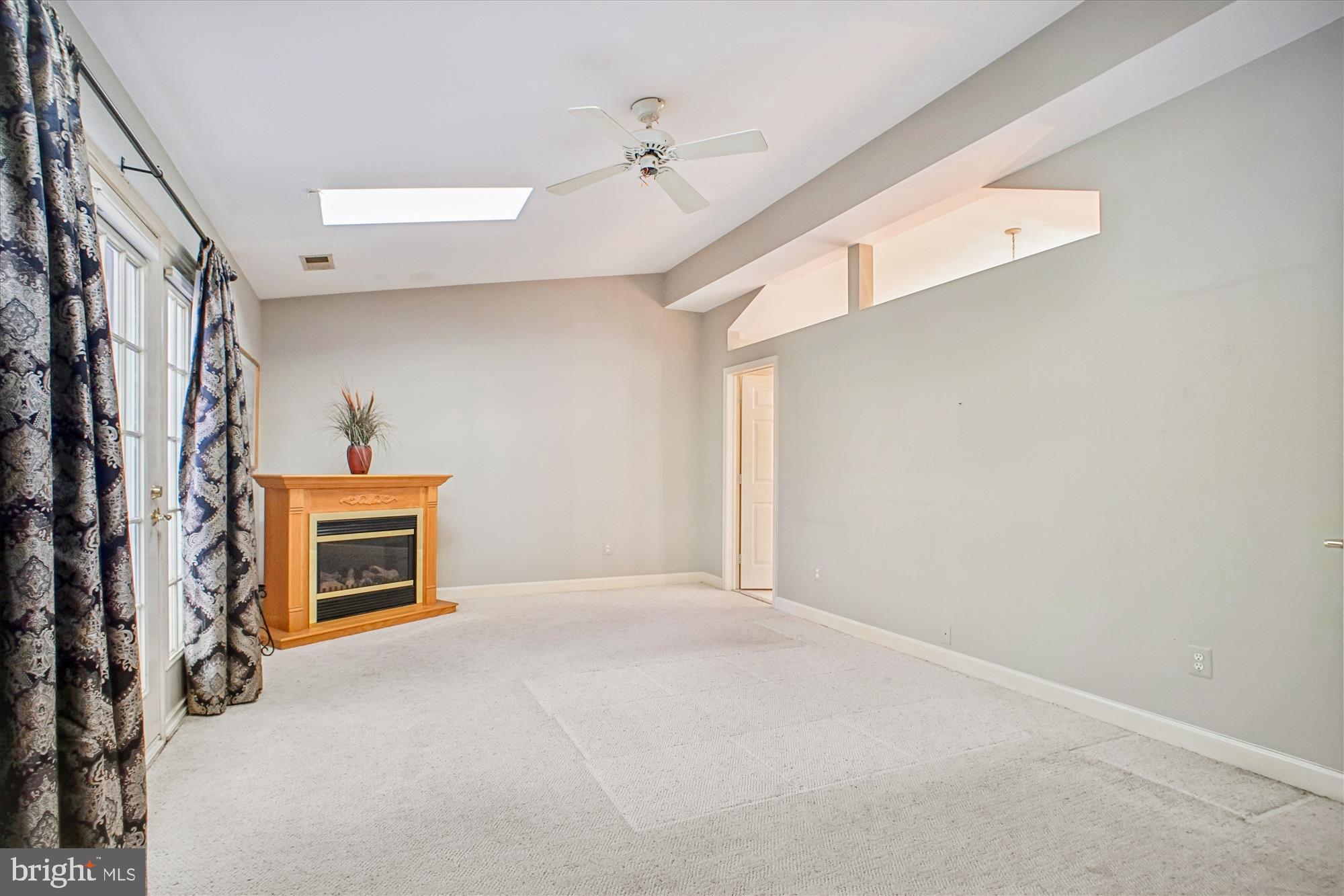 2627 Five Oaks Road Vienna, VA 22181 - Photo 52 of 111 a view of an empty room with a fireplace and a window